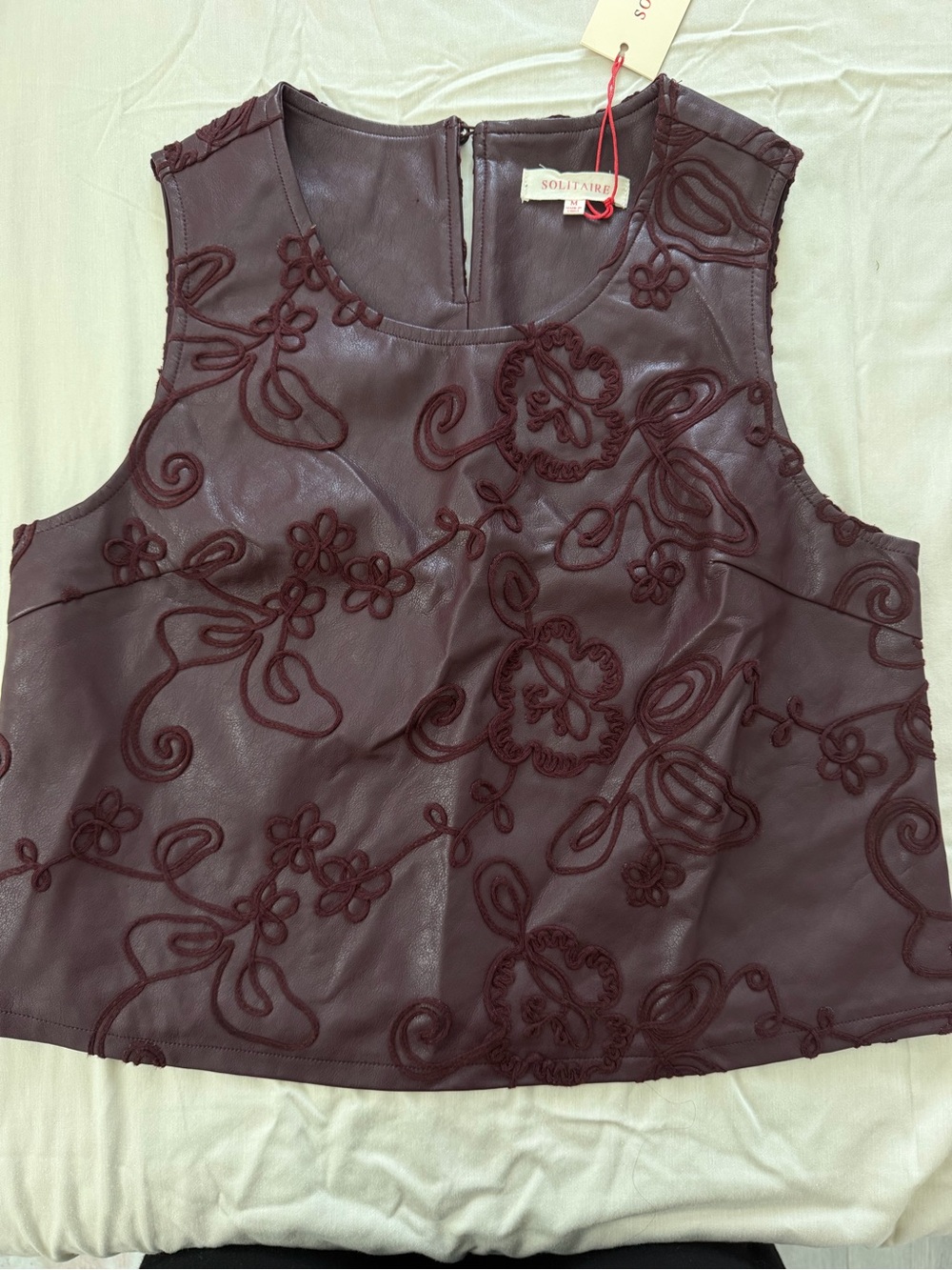 Solitaire Sleeveless Floral Appliqué leather top in Plum